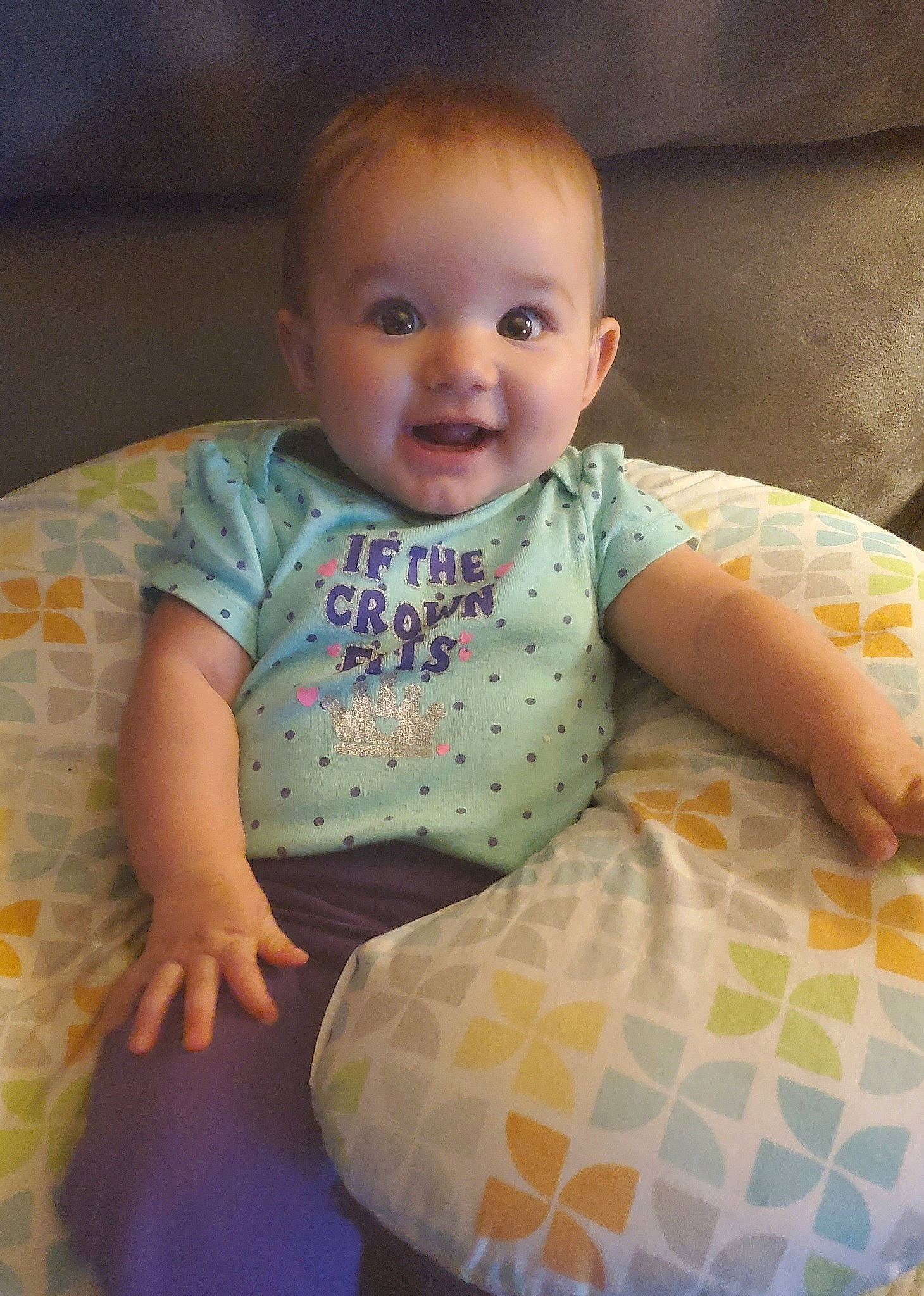 Shylah is registered to the contest to win money with this photo: baby, baby_products, baby_toddler_clothing, cheek, child, comfort, flooring, fun, happy, linens, pattern, person, product, room, sitting, skin, sleeve, smile, t_shirt, toddler