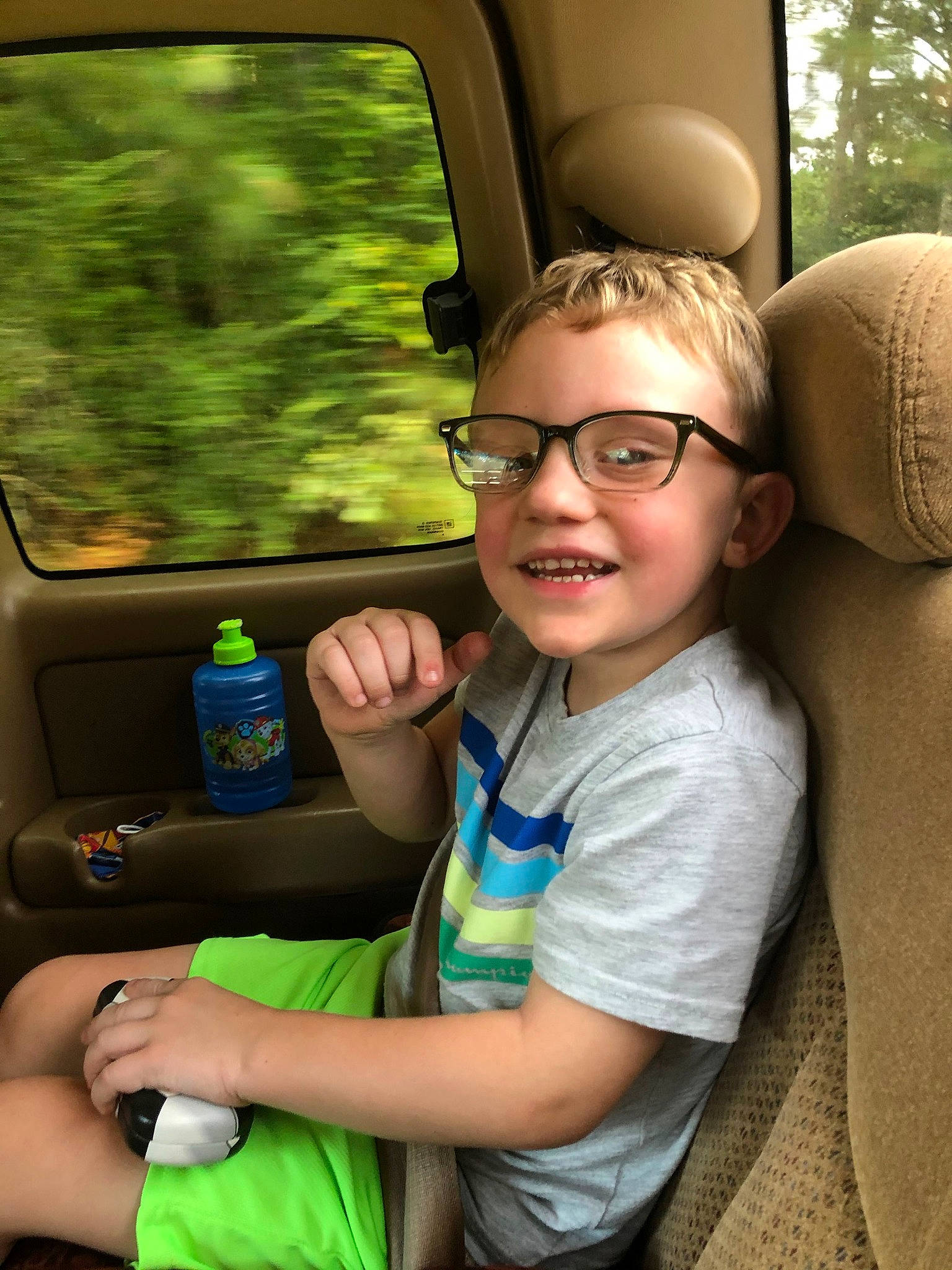 Dustyn joined the competition — help win amazing prizes! auto_part, automotive_design, automotive_exterior, car, car_seat, eyewear, finger, fun, gesture, glasses, hand, joy, leisure, motor_vehicle, person, plant, smile, steering_wheel, thumb, vehicle