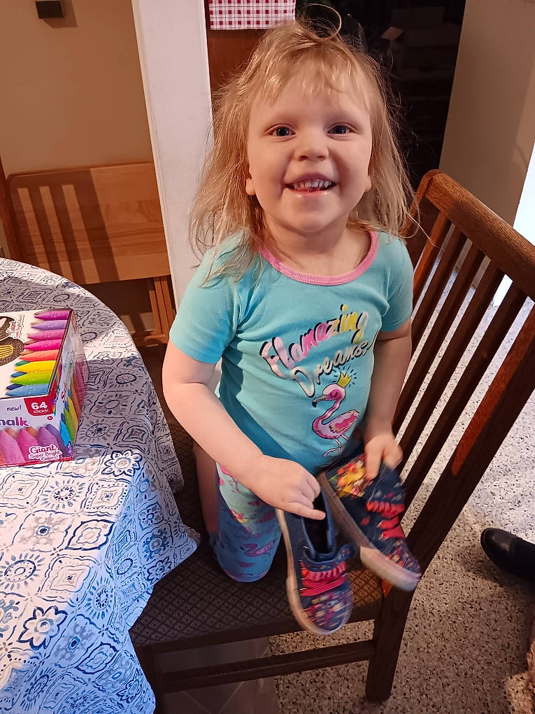 Presley is registered to the contest to win money with this photo: baby_toddler_clothing, child, flooring, fun, happy, human_leg, iris, joy, pattern, person, play, room, shoe, shorts, shoulder, sitting, sleeve, smile, t_shirt, thigh