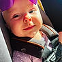 Kaylee joined the competition — help win amazing prizes! baby, car_seat, child, close_up, clothing, cute, face, harness, headwear, indoors, infant, polka_dot, portrait, purple_bow, safety, seatbelt, skin, smile, sunlight, young_child