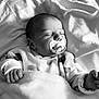 Melya participe au concours pour gagner de l'argent avec cette photo : baby, sleeping, pacifier, blanket, infant, cozy, black_and_white, peaceful, soft_texture, clothing, bed, newborn, cute, portrait, child, resting, indoors, hand, face, calm