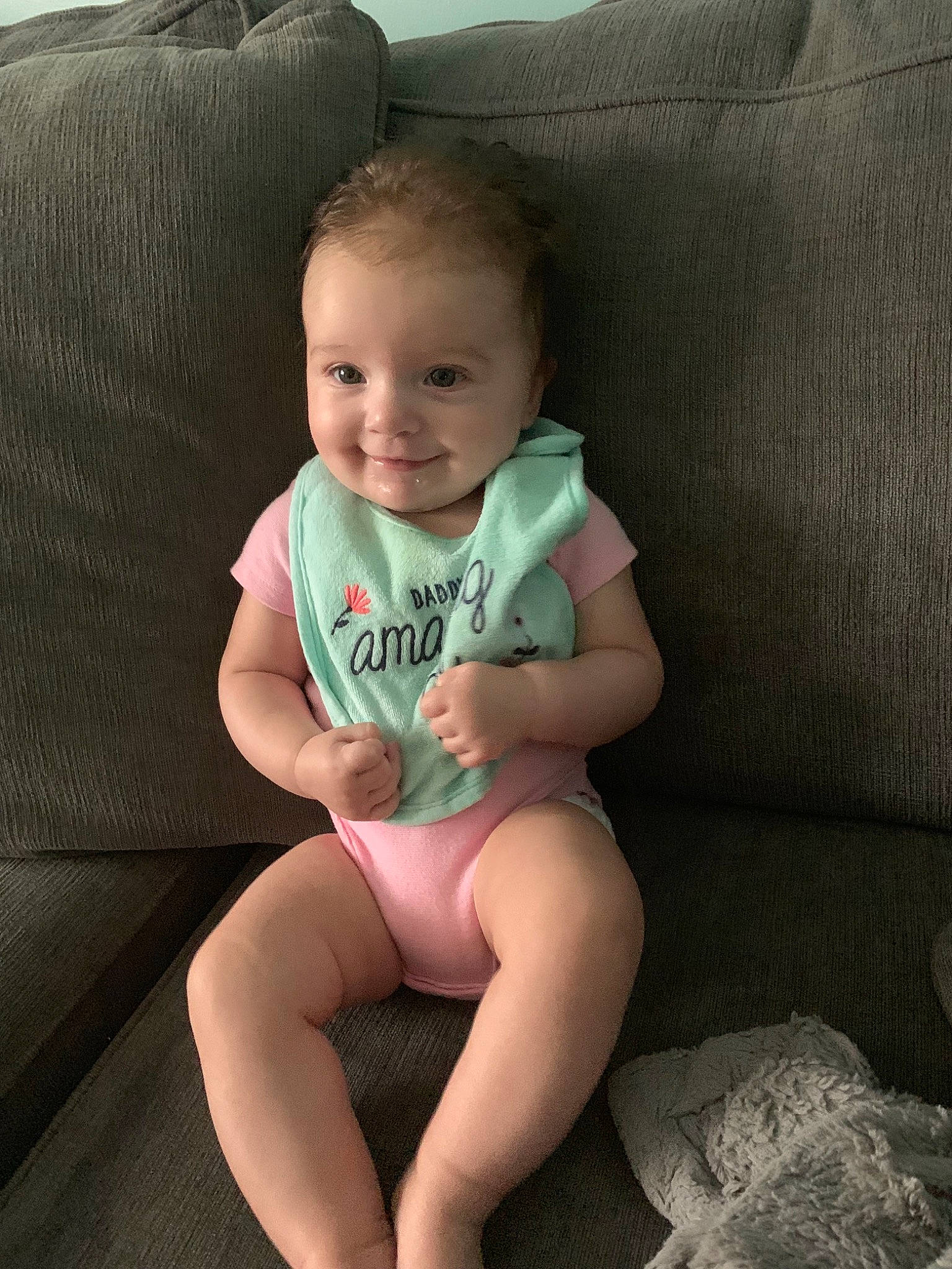 Tinsley is registered to the contest to win money with this photo: abdomen, arm, baby, cheek, child, face, finger, head, human_leg, joint, joy, leg, person, sitting, skin, smile, thigh, toddler