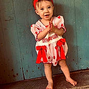 Elena joined the competition — help win amazing prizes! adorable, barefoot, birthday, birthday_girl, blue_wall, celebration, child, clapping, dress, happy, outdoor, photography, portrait, red_and_white, red_bow, rustic, smiling, standing, toddler, wooden_porch