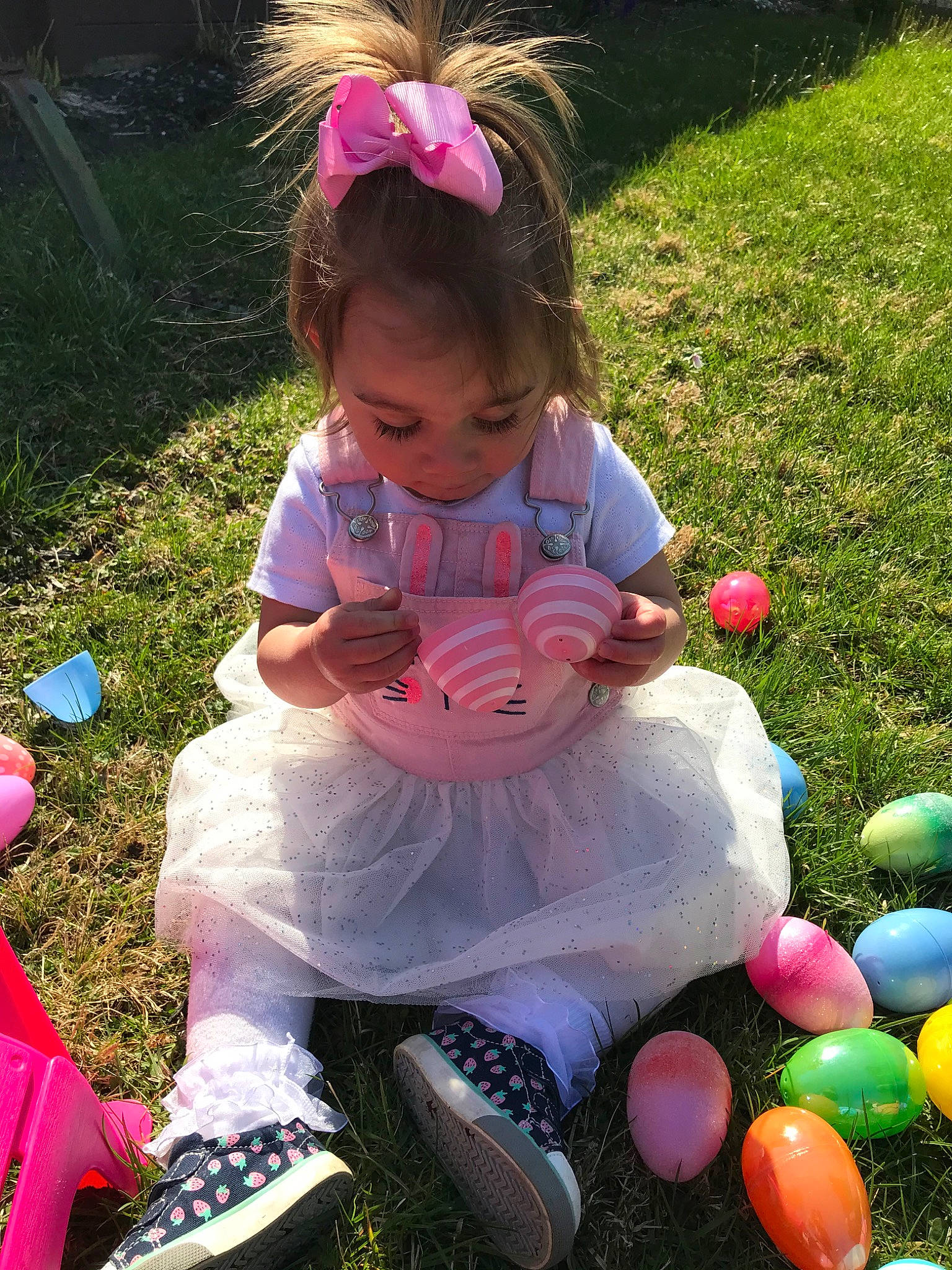 Adelina Marie joined the competition — help win amazing prizes! child, easter, easter_egg, fun, grass, holiday, person, pink, play, sitting, toddler