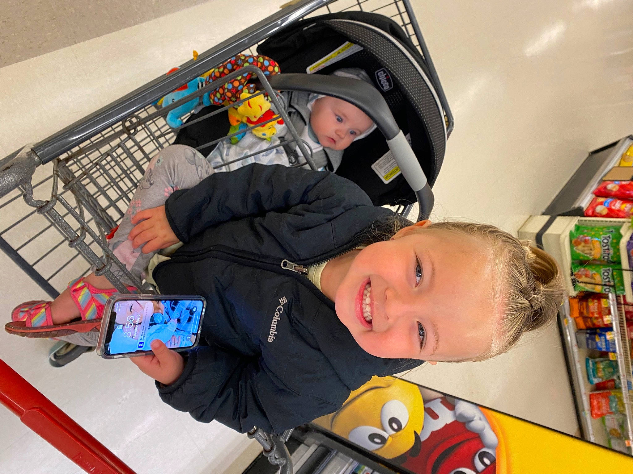Kylie joined the competition — help win amazing prizes! baby, baby_products, bookcase, child, fun, headwear, helmet, jacket, joy, motor_vehicle, person, personal_protective_equipment, play, recreation, room, service, shelf, smile, toddler