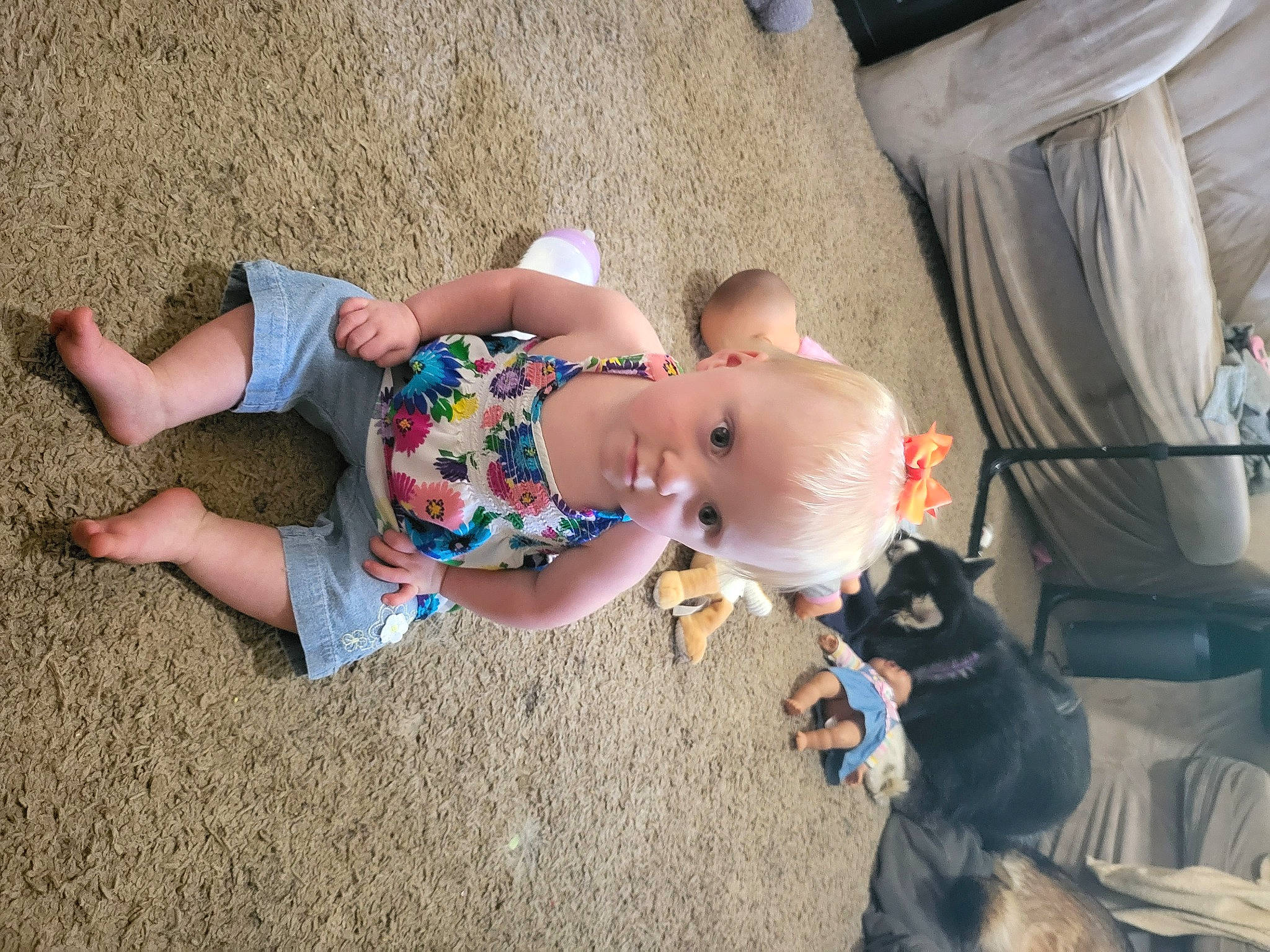 Billie is registered to the contest to win money with this photo: abdomen, baby, barefoot, child, comfort, event, fawn, flooring, foot, fun, grass, human_leg, knee, leisure, person, play, sand, sitting, thigh, toddler