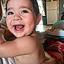 arm, baby, blanket, child, cute, expression, face, fridge, hand, happy, holding, home, indoor, infant, joy, kitchen, person, skin, smiling, toy