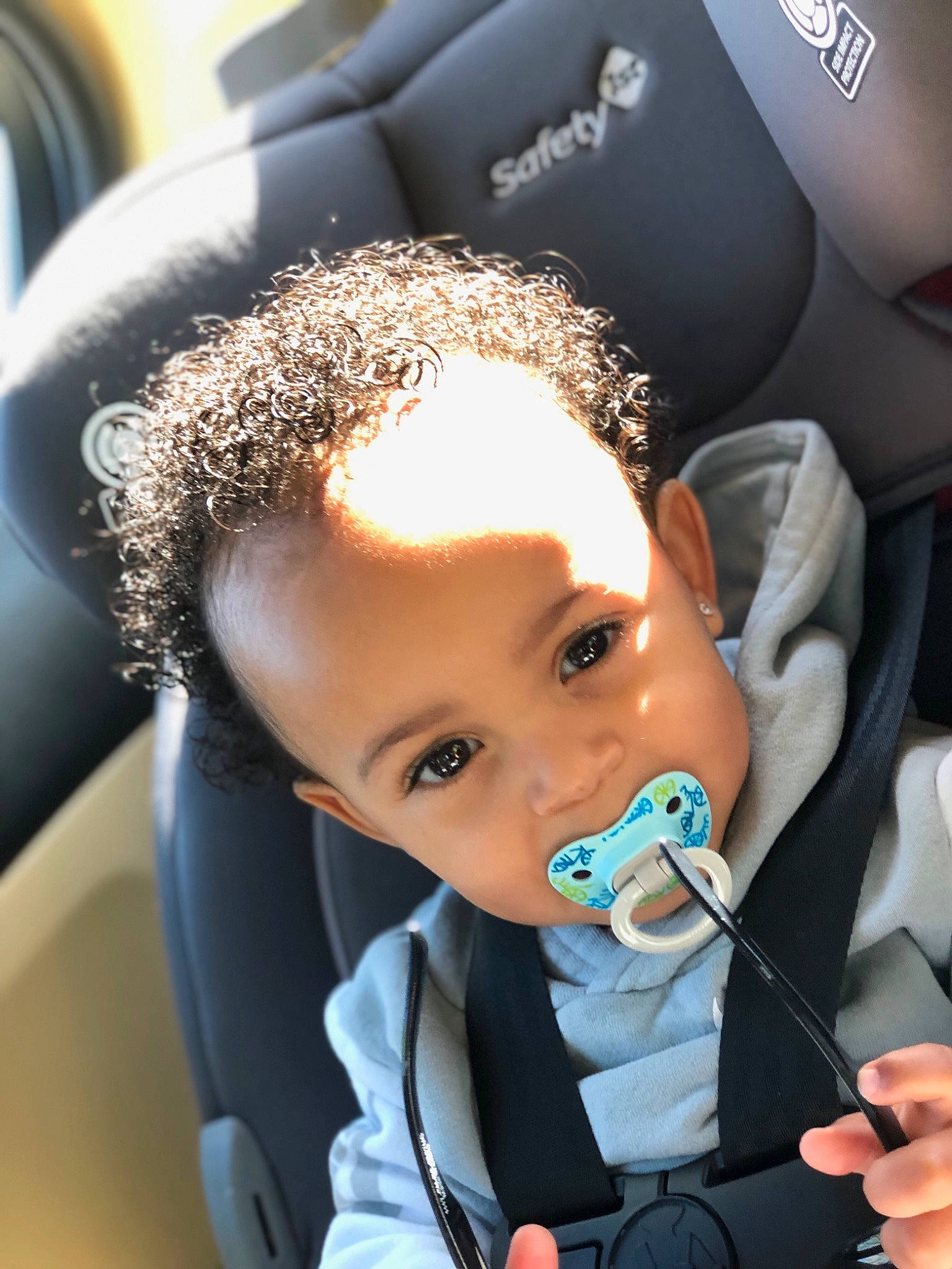 Kamron is registered to the contest to win money with this photo: auto_part, baby, baby_in_car_seat, car, car_seat, child, driving, ear, family_car, head_restraint, joy, person, product, seat_belt, steering_part, steering_wheel, toddler