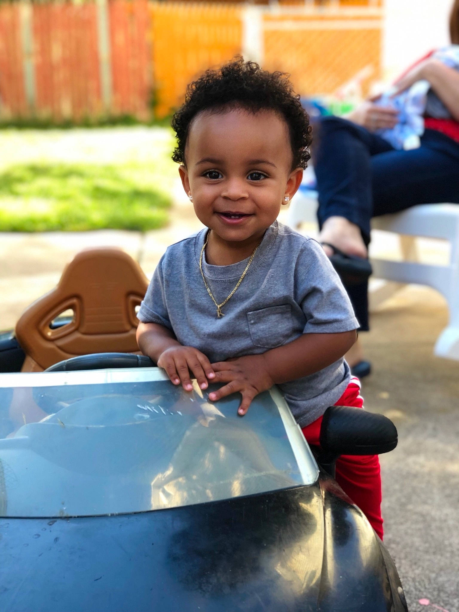 Kamron is registered to the contest to win money with this photo: baby, child, face, family_car, fun, happy, joy, leisure, person, play, playground, recreation, sitting, smile, toddler, vacation, vehicle