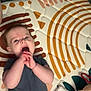 Brynlee is registered to the contest to win money with this photo: baby, infant, child, hands, mouth, mat, pattern, toy, blanket, indoor, floor, curious, lying_down, cute, soft_toy, colorful, person, young_child, human, sleepwear