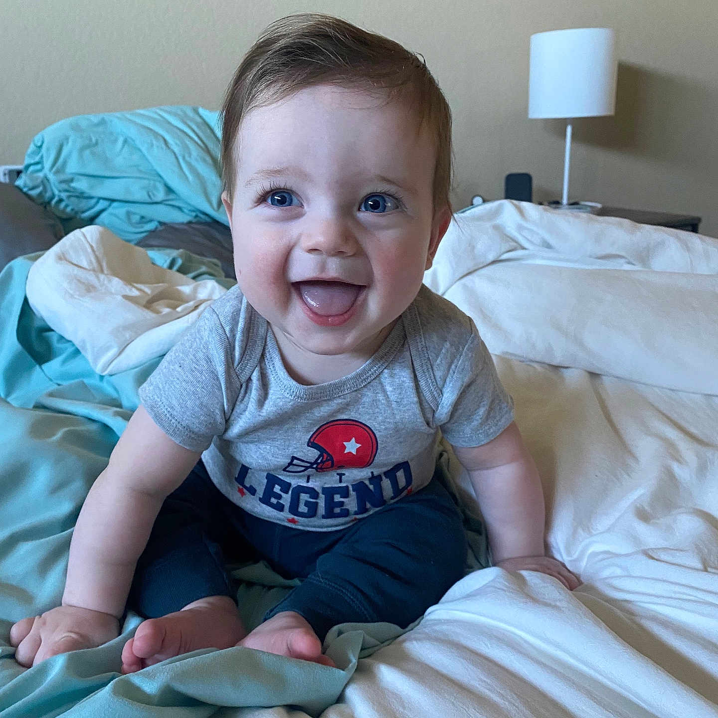 Ellis joined the competition — help win amazing prizes! baby, bed, bedroom, clothing, cushion, electronics, face, furniture, happy, head, homedecor, indoors, lamp, person, photoframe, photography, portrait, room, speaker, t_shirt