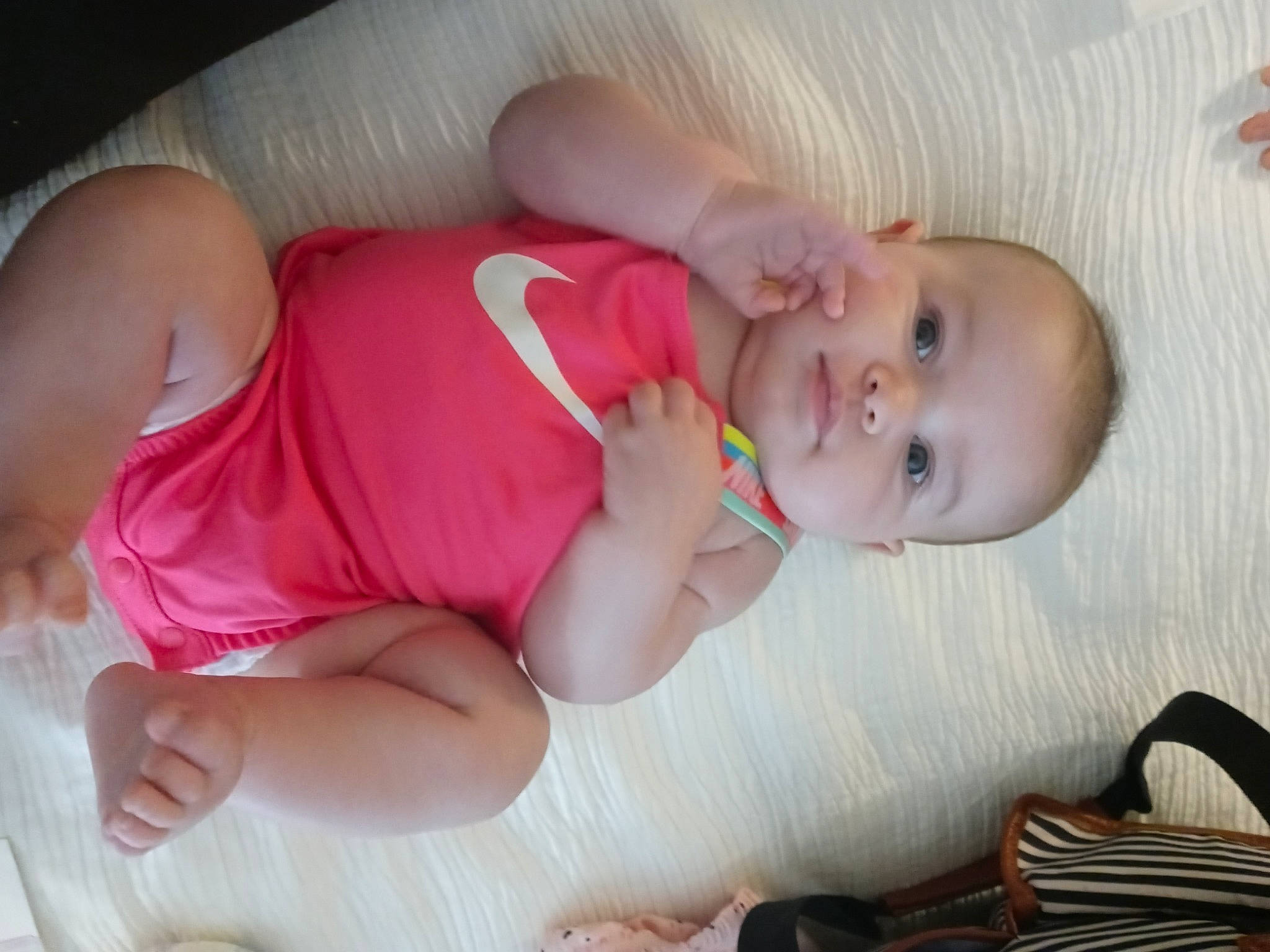 Willow Rose is registered to the contest to win money with this photo: arm, baby, baby_products, baby_toddler_clothing, cheek, child, comfort, eye, finger, human_body, iris, lip, mouth, nail, person, pink, skin, smile, thigh, toddler