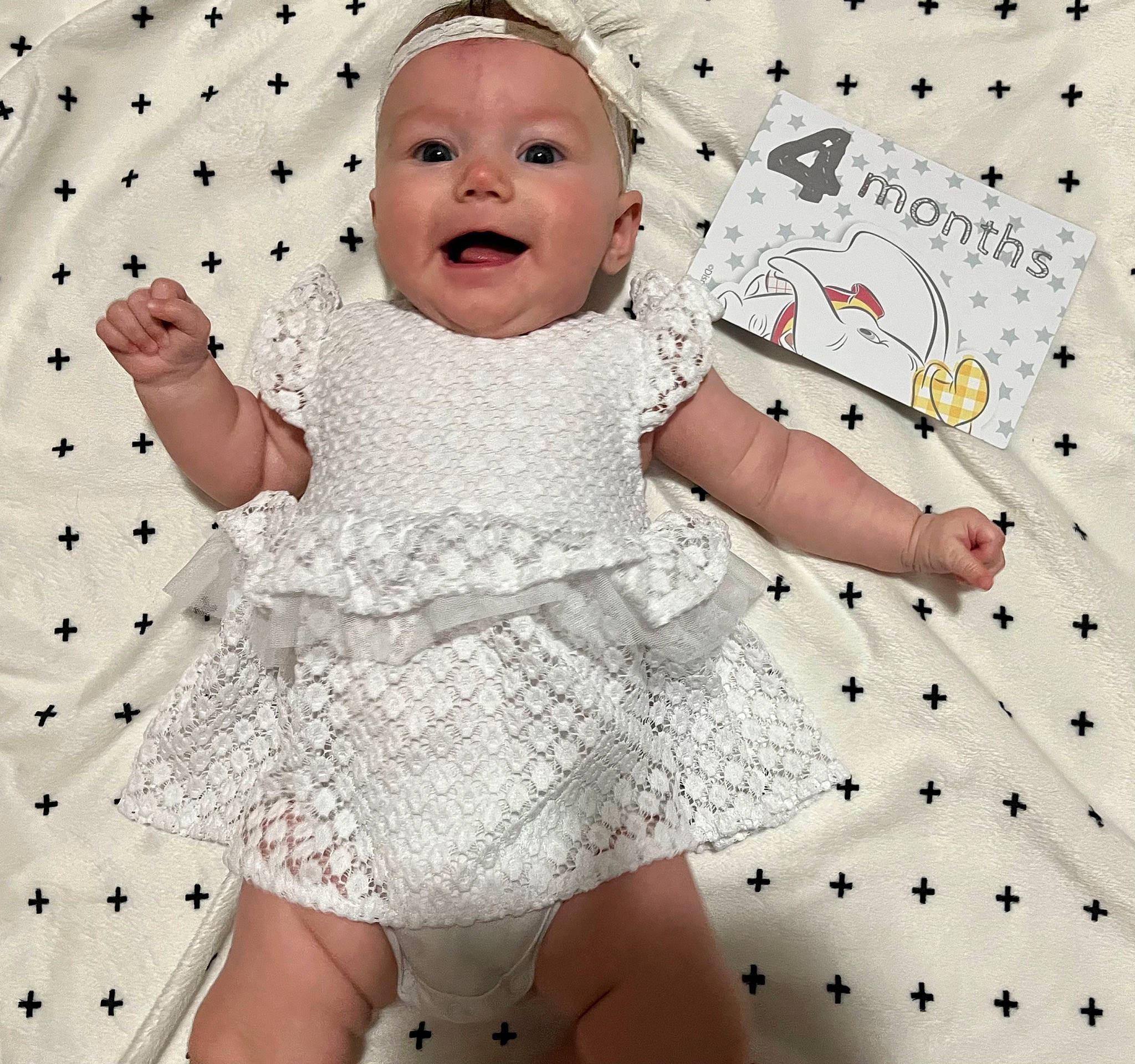 Bella joined the competition — help win amazing prizes! arm, baby_toddler_clothing, child, day_dress, embellishment, facial_expression, finger, gesture, hand, happy, one_piece_garment, pattern, person, pink, skin, sleeve, smile, textile, thumb, toddler