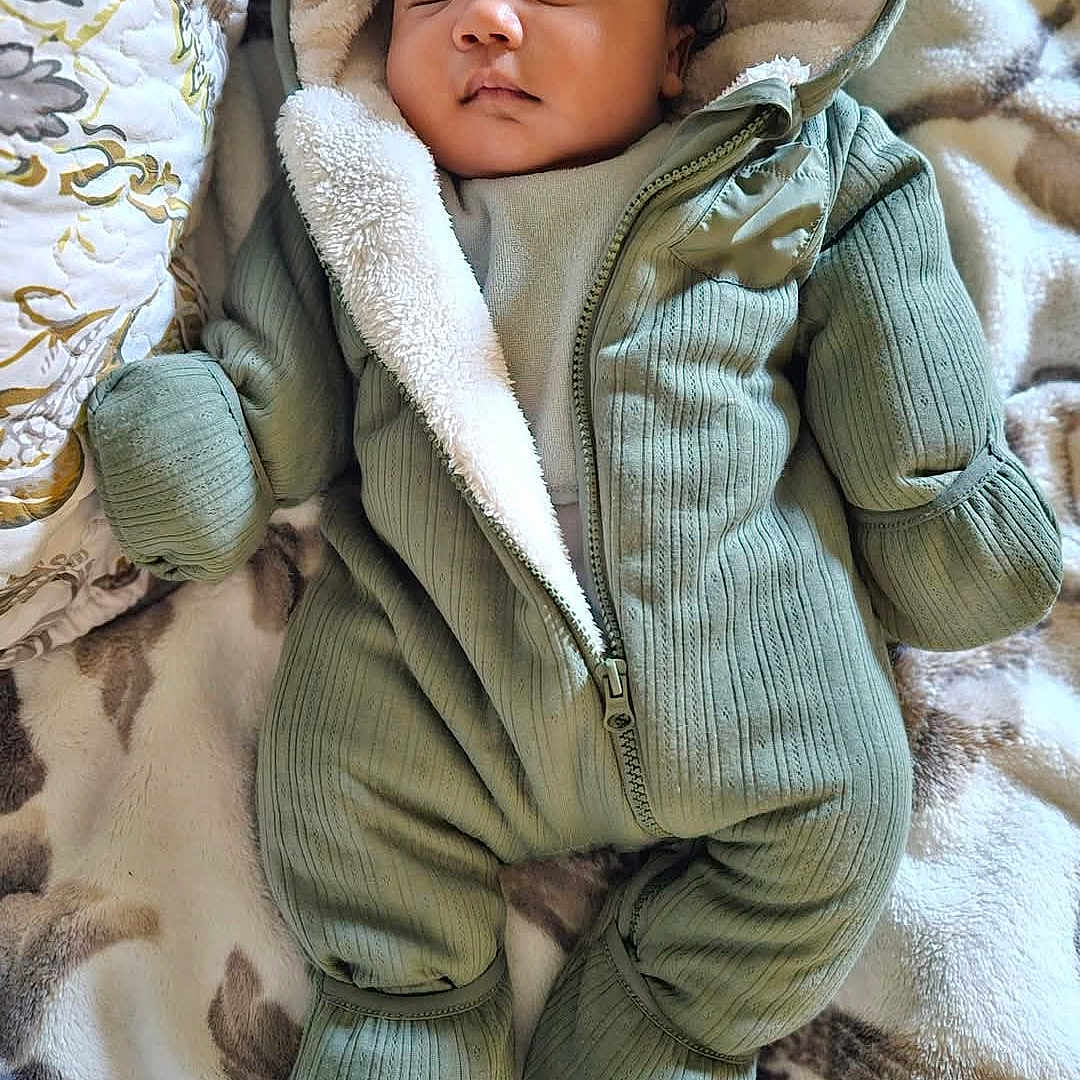 Elijah joined the competition — help win amazing prizes! baby, blanket, bonnet, clothing, coat, face, happy, hat, head, jacket, newborn, person, photography, portrait, quilt, sleeping, smile, yawning