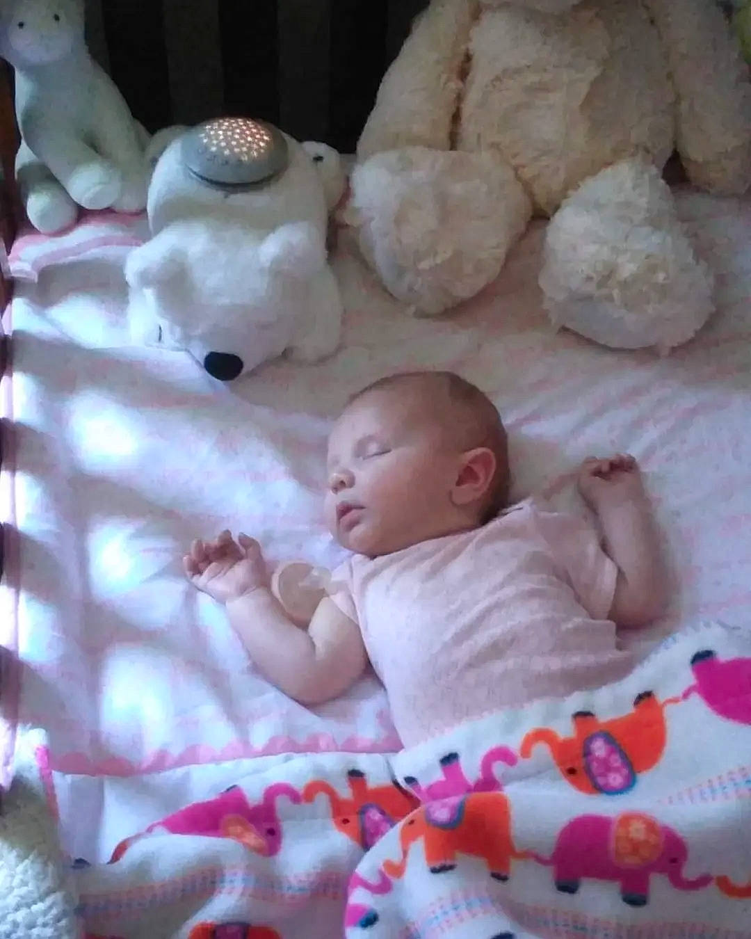 Octavia is registered to the contest to win money with this photo: baby, baby_products, baby_toddler_clothing, bed_sheet, bedding, bedtime, carmine, child, comfort, event, fur, linens, pattern, person, pink, room, stuffed_toy, textile, toddler, toy