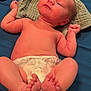 Lynnwood joined the competition — help win amazing prizes! baby, infant, diaper, barefoot, lying_down, cloth, blue_background, newborn, skin, cute, small, child, human, foot, hand, face, head, expression, resting, indoors