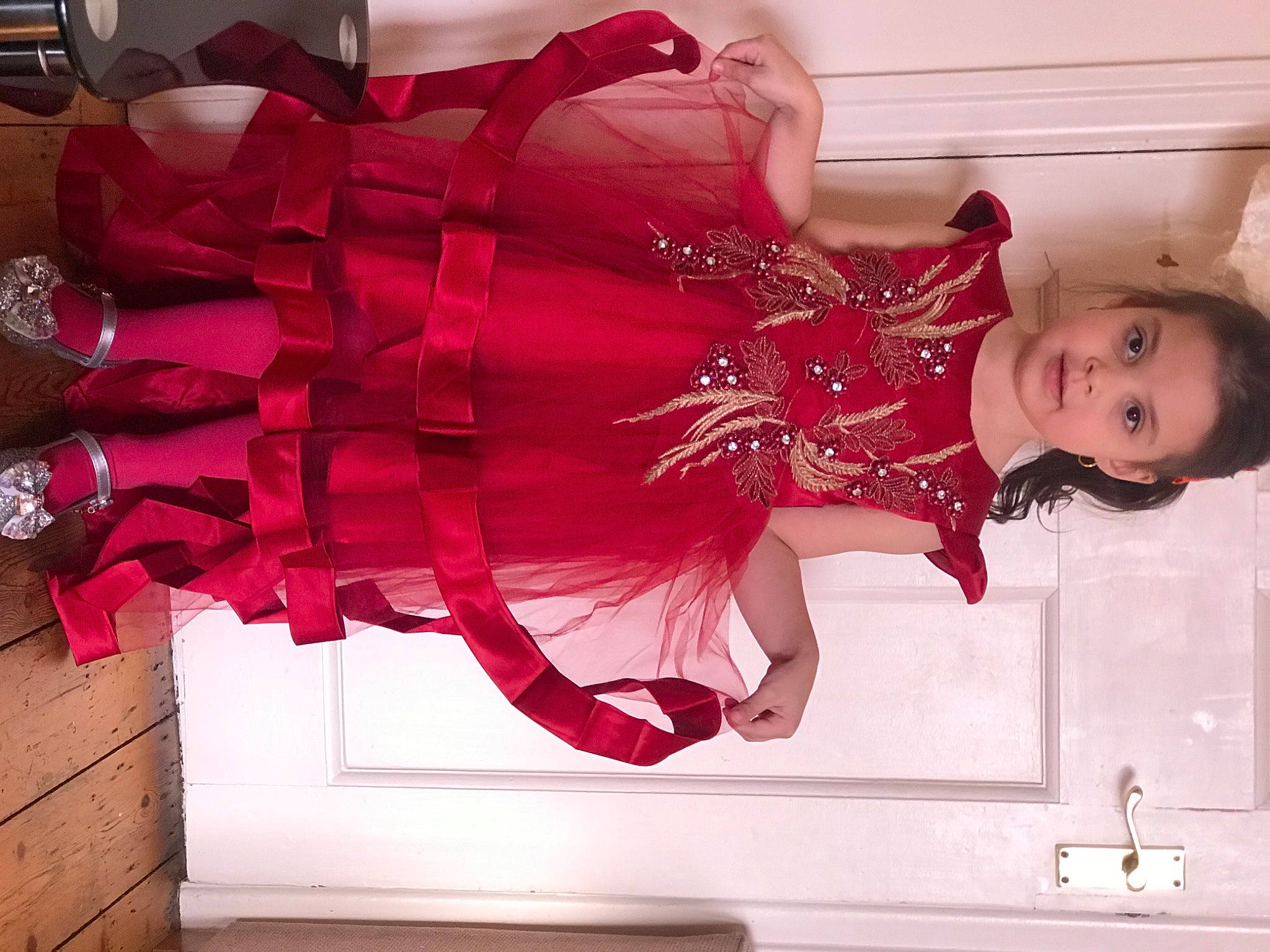 Fatima is registered to the contest to win money with this photo: beauty, boot, carmine, dress, event, fashion_design, fun, happy, high_heels, human_leg, leg, magenta, pattern, person, pink, red, room, smile, textile, thigh