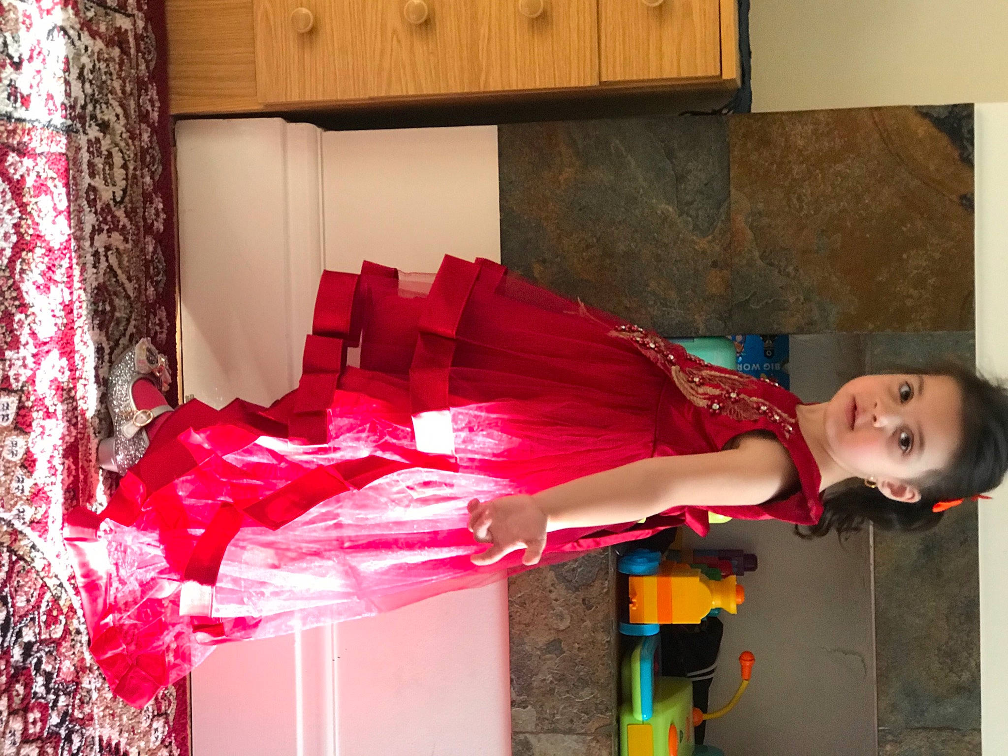 Fatima joined the competition — help win amazing prizes! cabinetry, carmine, costume, curtain, event, fashion_design, flesh, fun, magenta, pattern, person, red, room, street_fashion, toddler, wood