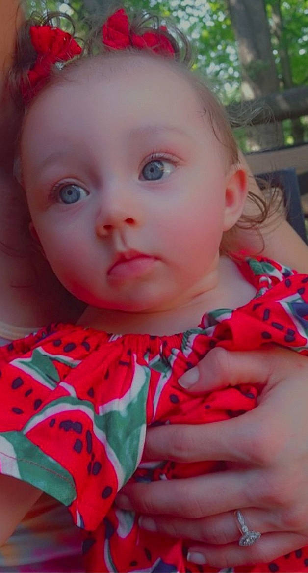 Ariah joined the competition — help win amazing prizes! baby_toddler_clothing, cheek, chin, dress, eyelash, facial_expression, happy, iris, lip, mouth, neck, nose, outerwear, person, pink, plant, product, red, skin, textile