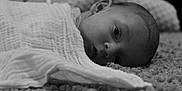 Mattia participe au concours pour gagner de l'argent avec cette photo : baby, blanket, carpet, face, head, infant, laying, looking, monochrome, monochromatic, newborn, person, portrait, resting, soft_texture, wrapped, young, indoor, closeup, sleepy