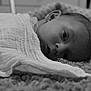 baby, blanket, carpet, face, head, infant, laying, looking, monochrome, monochromatic, newborn, person, portrait, resting, soft_texture, wrapped, young, indoor, closeup, sleepy