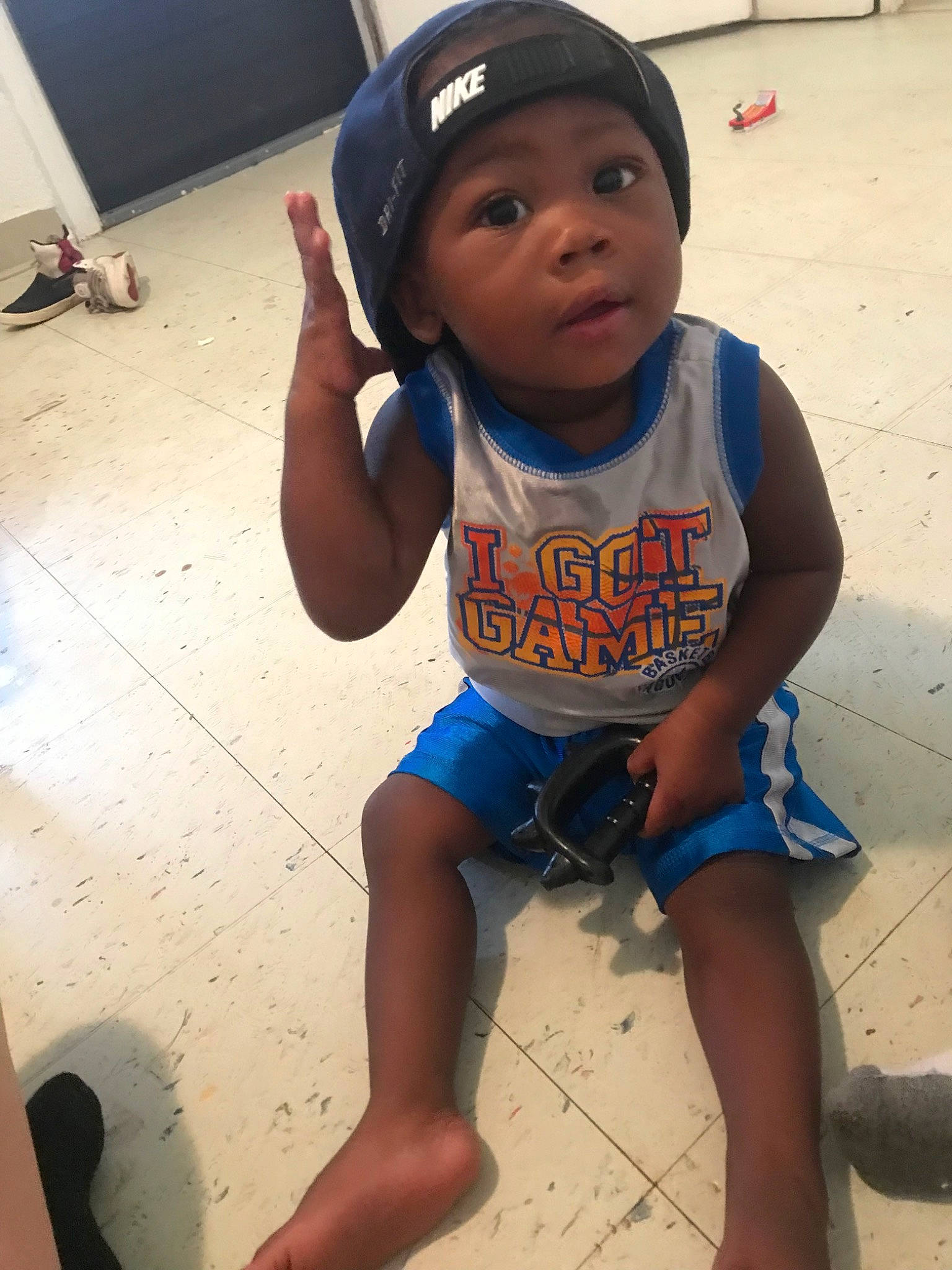 Kyison is registered to the contest to win money with this photo: child, cool, fun, headwear, leg, person, play, sitting, skin, smile, t_shirt, thigh, toddler, vacation, world