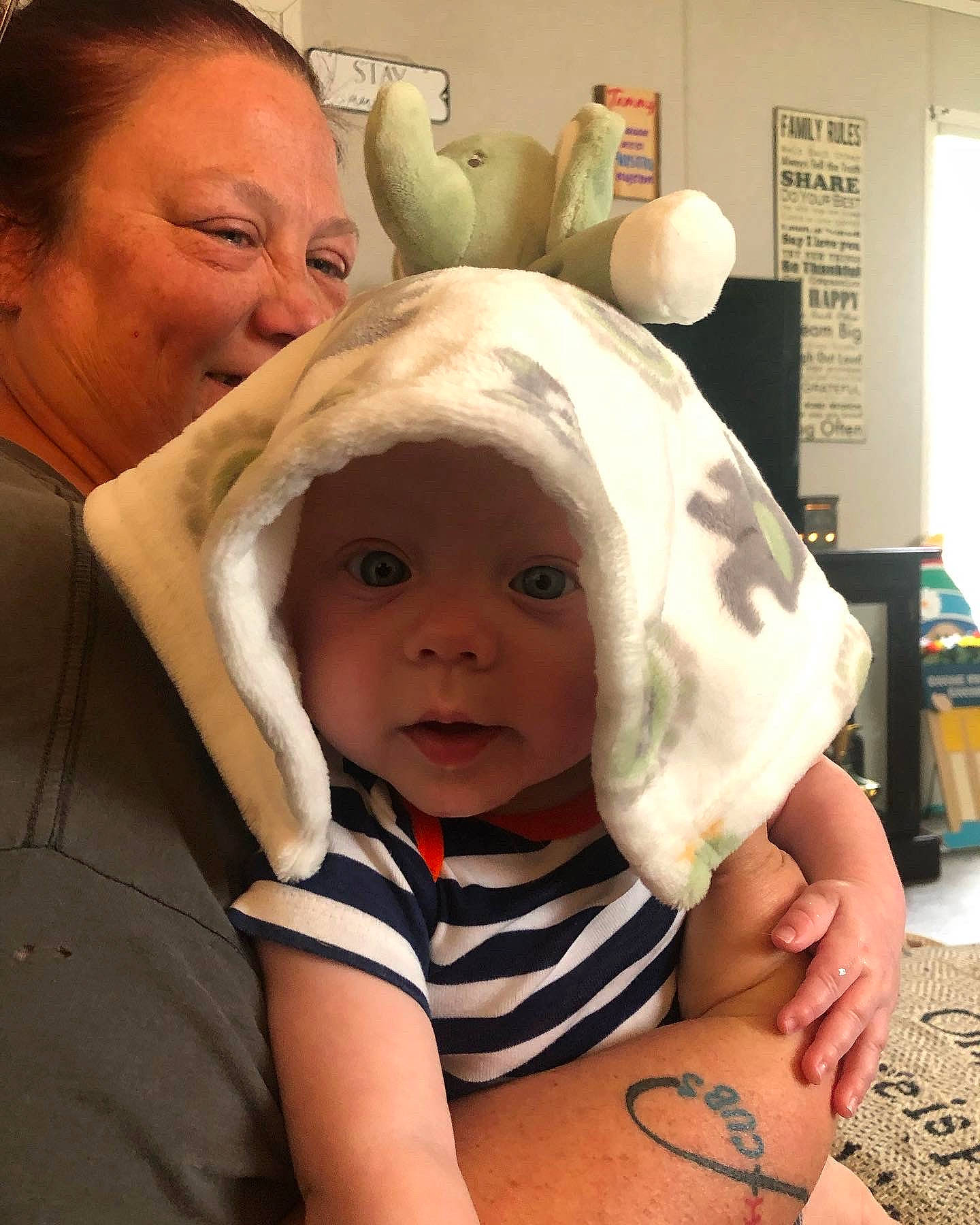 Kyson is registered to the contest to win money with this photo: baby, baby_toddler_clothing, cheek, child, comfort, ear, elbow, event, finger, fun, gesture, happy, headwear, nose, organ, person, room, skin, smile, thumb