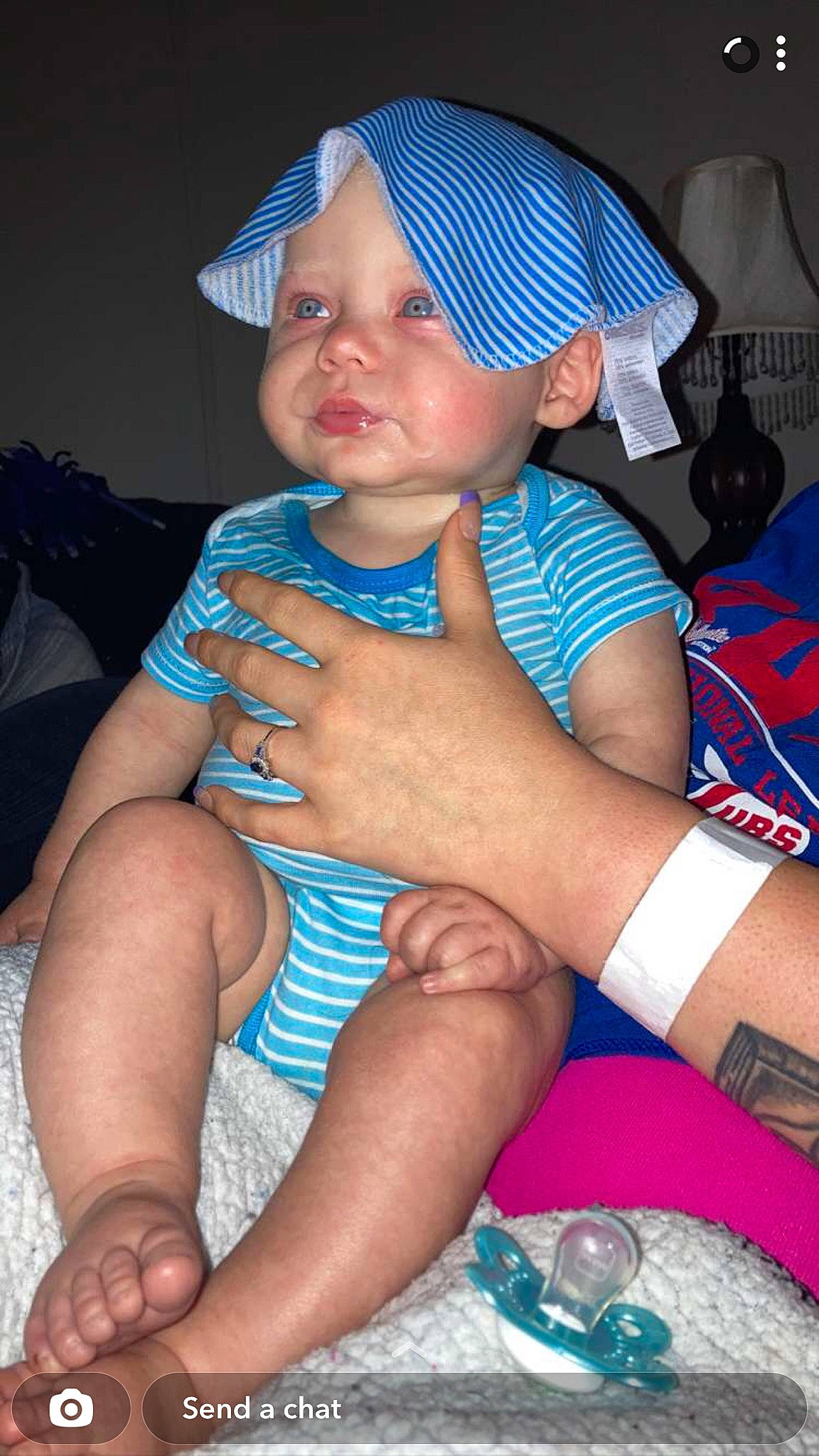 Kyson is registered to the contest to win money with this photo: baby, baby_toddler_clothing, baseball_cap, black, blue, cap, electric_blue, finger, fun, hand, hat, headgear, headwear, human_leg, lap, lip, nail, person, pink, skin