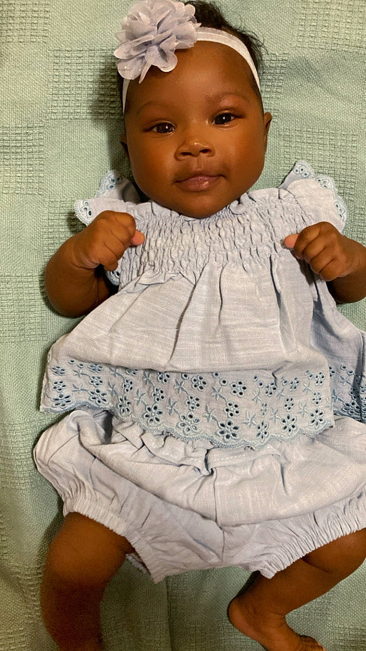 Aaliyah joined the competition — help win amazing prizes! baby, baby_toddler_clothing, cap, cheek, chin, comfort, eye, face, facial_expression, finger, gesture, happy, head, person, pink, product, skin, sleeve, textile, toddler