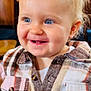 Iylee joined the competition — help win amazing prizes! toddler, child, smiling, blue_eyes, plaid_shirt, indoor, restaurant, happy, portrait, person, blond_hair, cute, buttoned_shirt, seated, young_child, face, cheerful, casual_clothing, warm_lighting, people_in_background