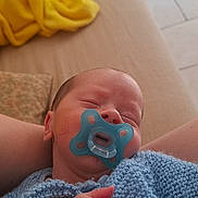 Lenny participe au concours pour gagner de l'argent avec cette photo : baby, blanket, blue, child, comfort, couch, cozy, furniture, hand, home, indoor, infant, knitted, pacifier, peaceful, person, relaxation, skin, sleeping, young