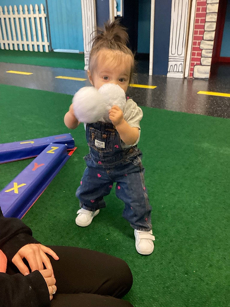 Tymber is registered to the contest to win money with this photo: baby, child, flooring, fun, games, grass, human_leg, knee, leisure, outdoor_play_equipment, person, physical_fitness, play, playground, recreation, room, sitting, sports, sportswear, sweatpant