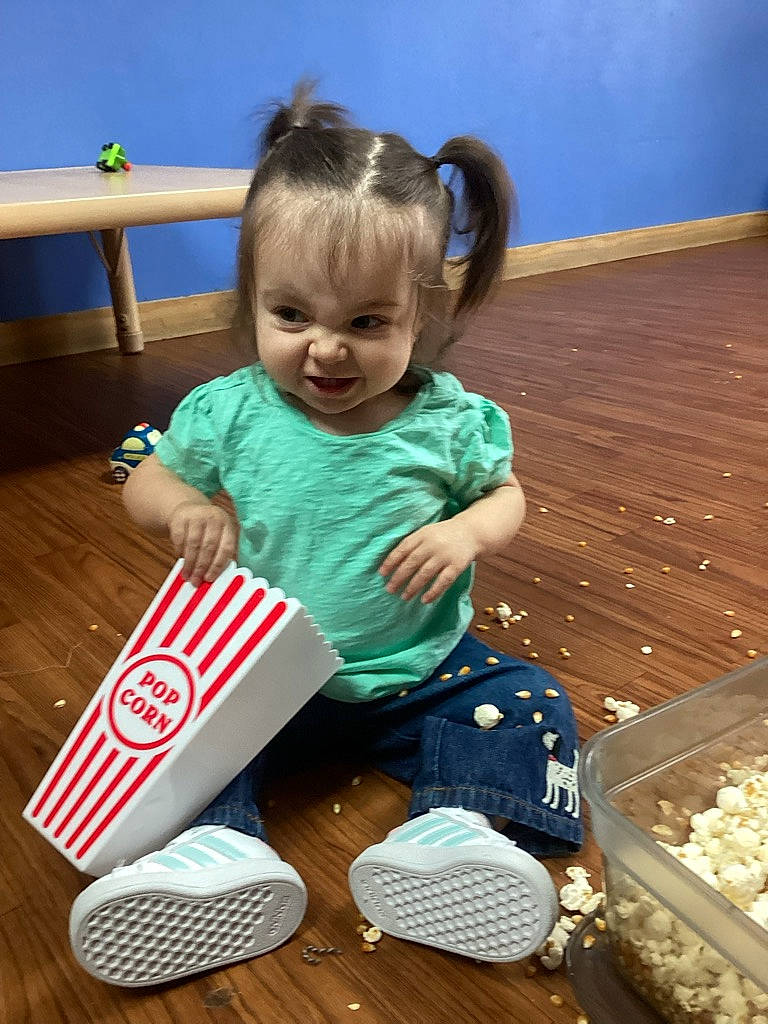 Tymber joined the competition — help win amazing prizes! baby, baby_playing_with_toys, baby_toddler_clothing, blue, child, flooring, fun, happy, hardwood, leisure, person, play, riding_toy, sitting, smile, sock, toddler, wood