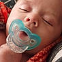 Eric is registered to the contest to win money with this photo: baby, blanket, child, closeup, comfort, cozy, cushion, face, hand, indoors, infant, pacifier, peaceful, portrait, relaxation, resting, skin, sleeping, soft, young
