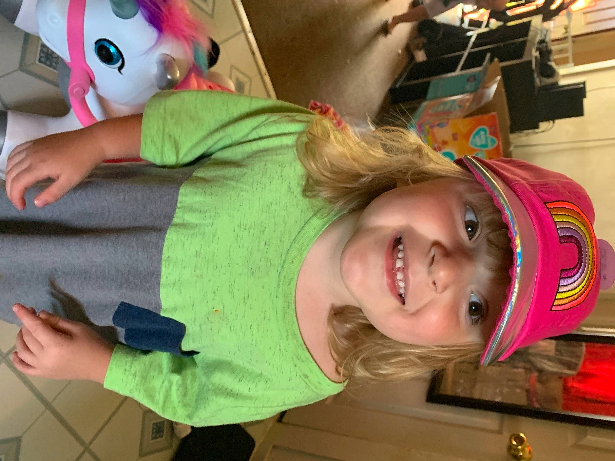 Sophia is registered to the contest to win money with this photo: child, costume, facial_expression, finger, fun, happy, headwear, joy, leisure, mouth, organ, person, photograph, play, plush, recreation, room, smile, snapshot, stuffed_toy