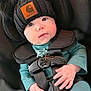 Layla is registered to the contest to win money with this photo: baby, car_seat, carhartt, child, closeup, clothing, cute, eyes, face, harness, hat, indoors, infant, knit_hat, person, pom_poms, portrait, seatbelt, small_hands, warm_clothing