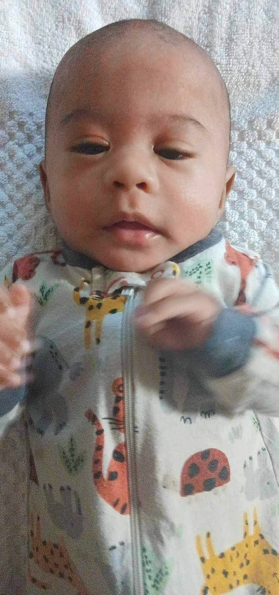 Mailani joined the competition — help win amazing prizes! baby, baby_products, baby_toddler_clothing, cheek, child, finger, grass, happy, linens, lip, nail, nose, pattern, person, sitting, skin, sleeve, textile, thumb, toddler