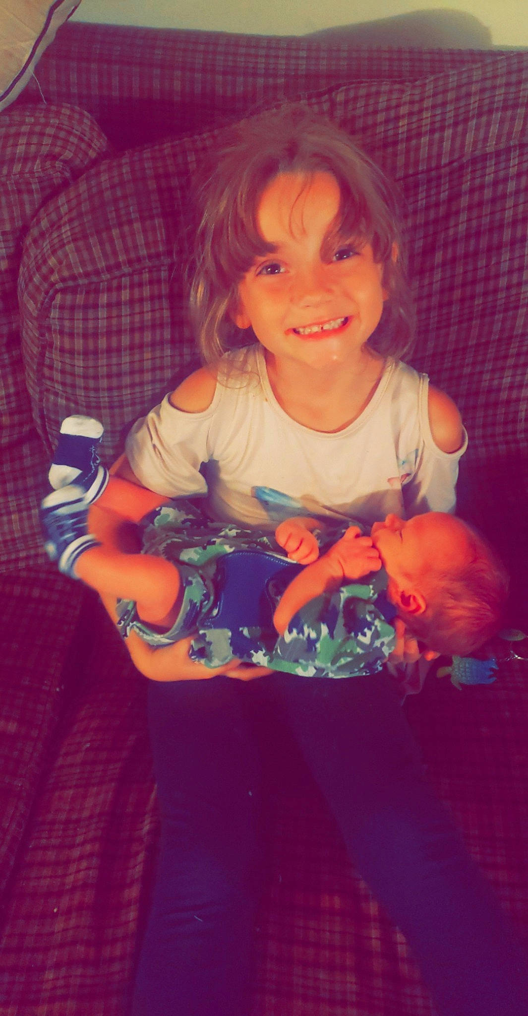 Miracle is registered to the contest to win money with this photo: arm, baby_toddler_clothing, cheek, dress, eye, face, hair, hairstyle, hand, happy, head, human_body, joy, leg, lip, mouth, nose, orange, person, purple