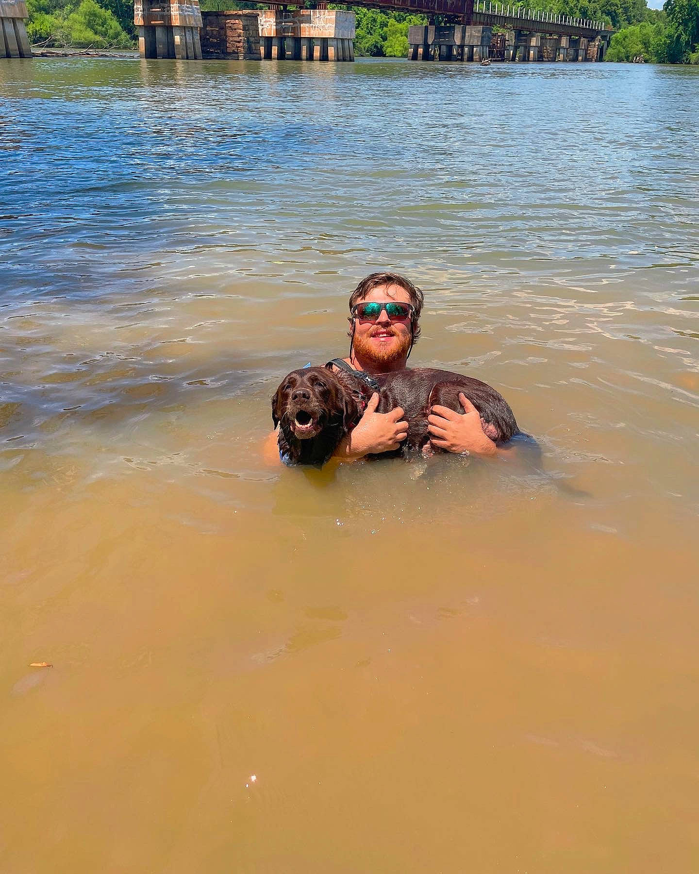 Chloe joined the competition — help win amazing prizes! body_of_water, event, eyewear, fun, goggles, lake, landscape, leisure, lifejacket, outdoor_recreation, personal_protective_equipment, recreation, reservoir, smile, sports, swimwear, tree, vehicle, water