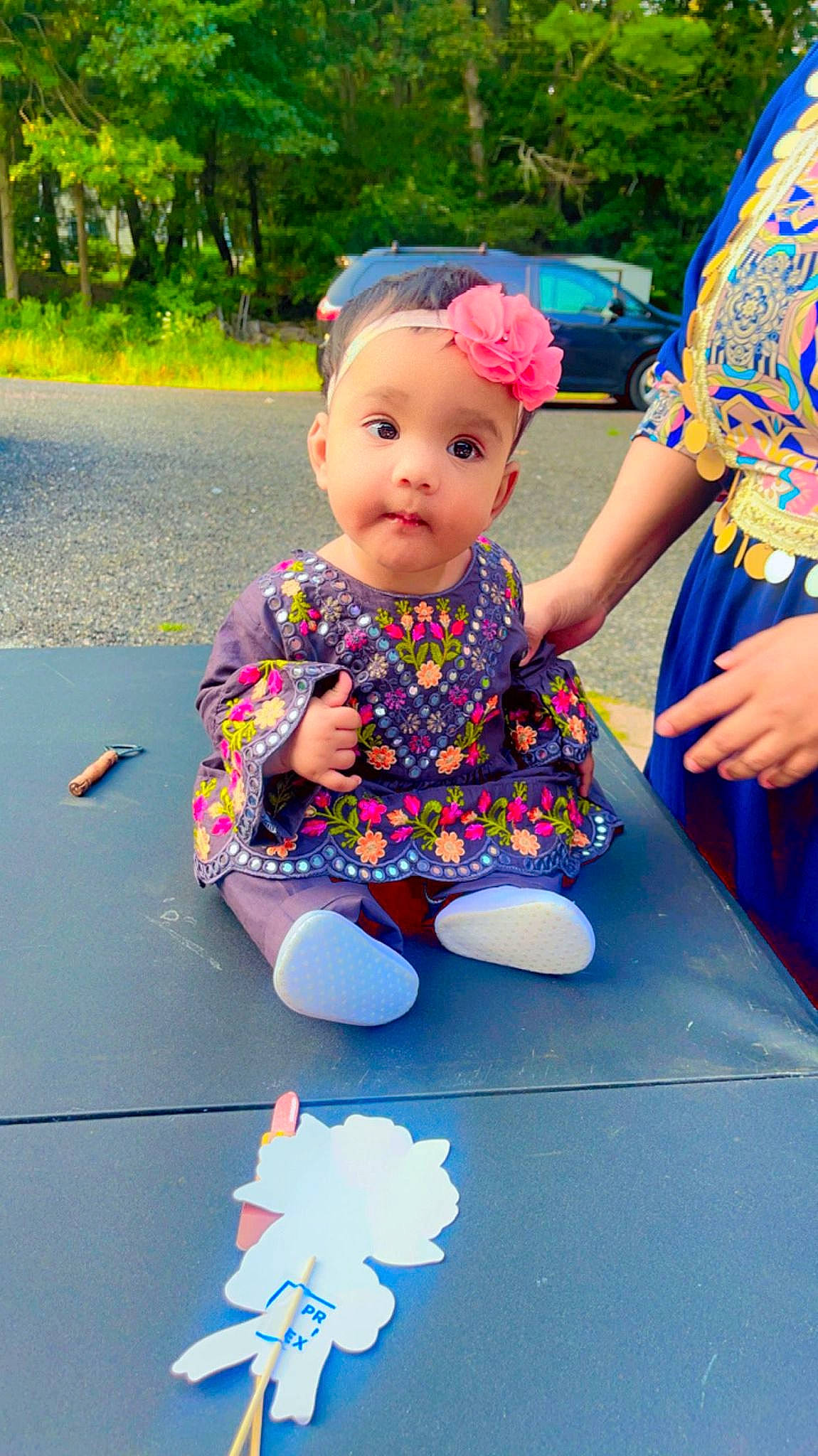 Abigail joined the competition — help win amazing prizes! art, baby, baby_toddler_clothing, blue, child, flooring, fun, grass, happy, leisure, magenta, pattern, person, pink, play, recreation, sitting, sleeve, toddler, tree