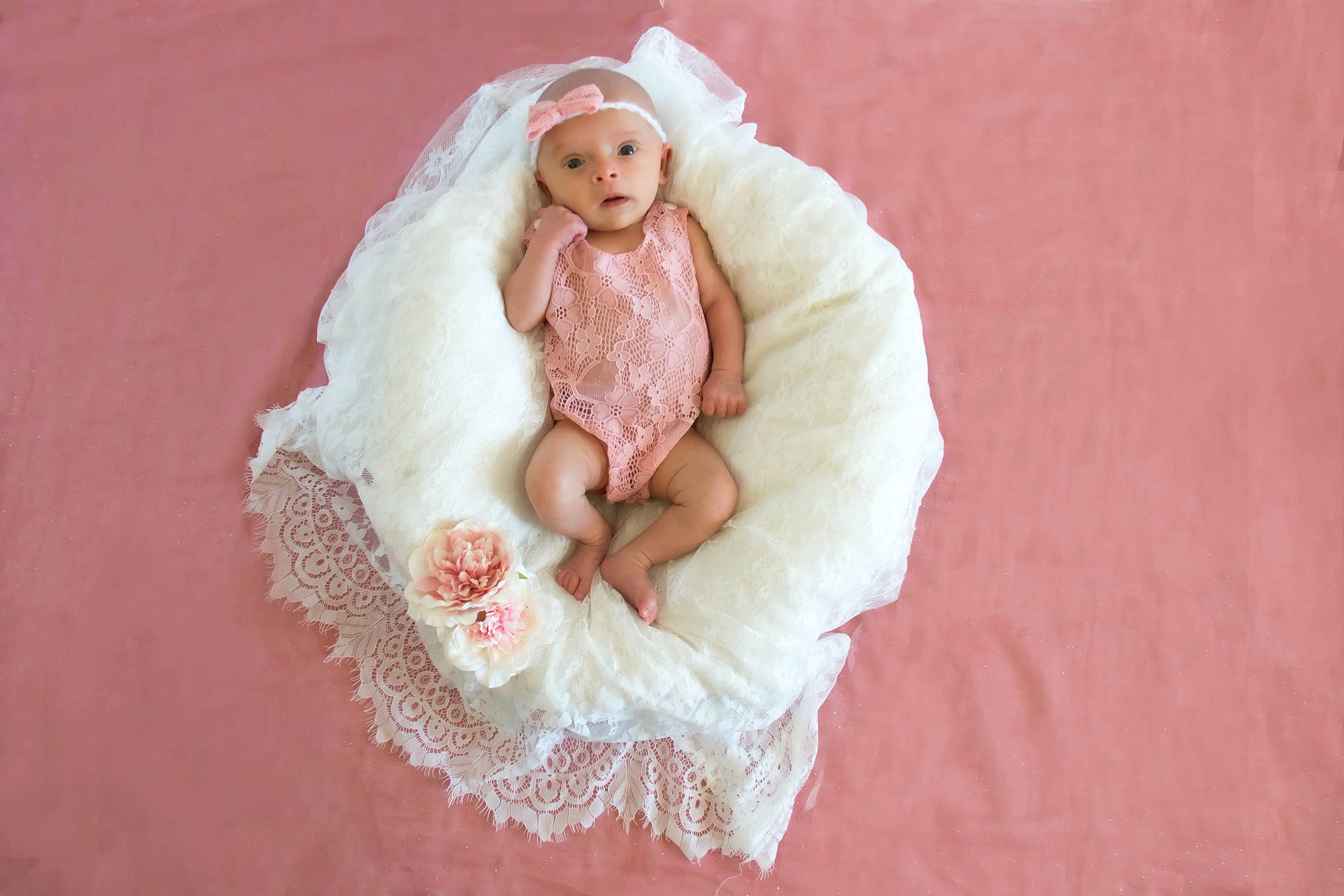 Amy participe au concours pour gagner de l'argent avec cette photo : arm, baby, bridal_accessory, comfort, doll, dress, embellishment, fashion_accessory, fur, hand, head, headgear, headwear, human_body, linens, peach, person, petal, pink, sleeve