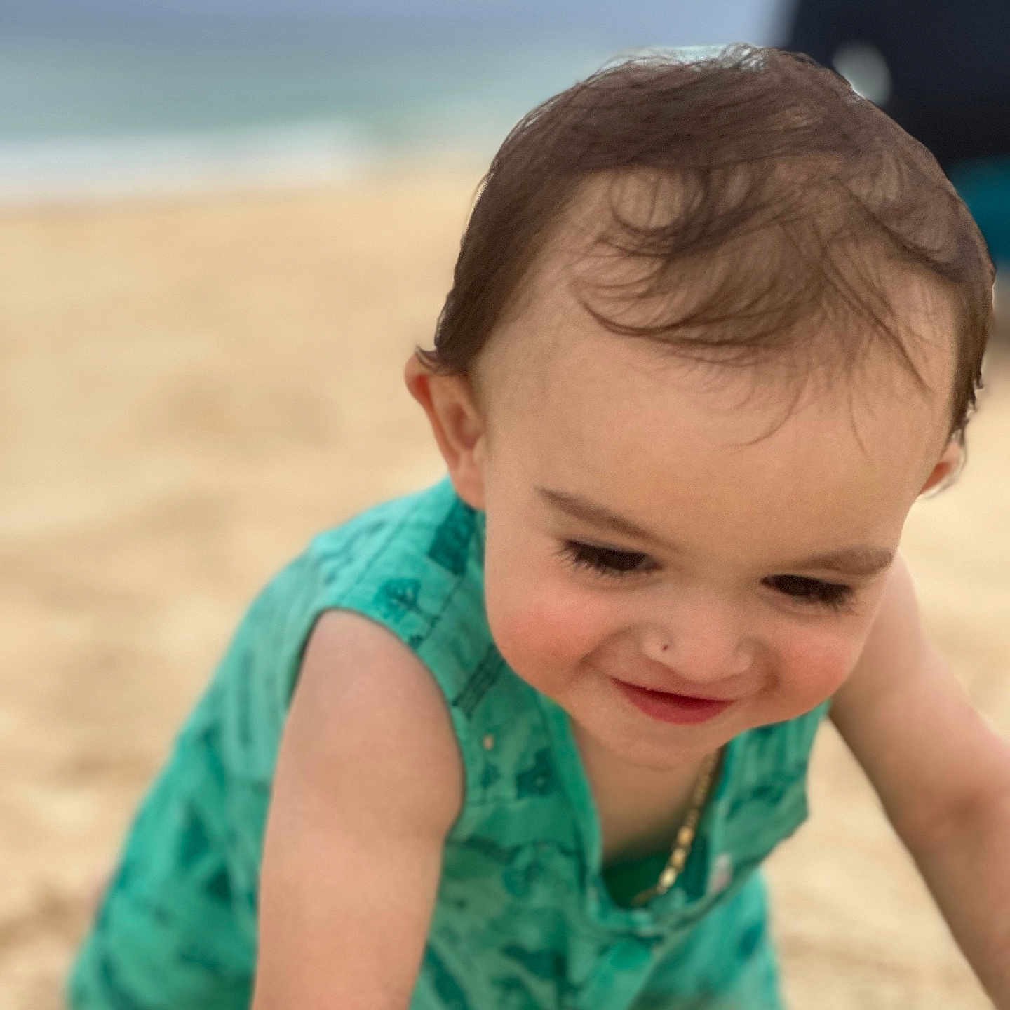 Liam is registered to the contest to win money with this photo: adult, baby, babycrawling, beach, clothing, coast, crawling, dress, face, head, male, man, nature, outdoors, person, photography, portrait, sea, shoreline, water