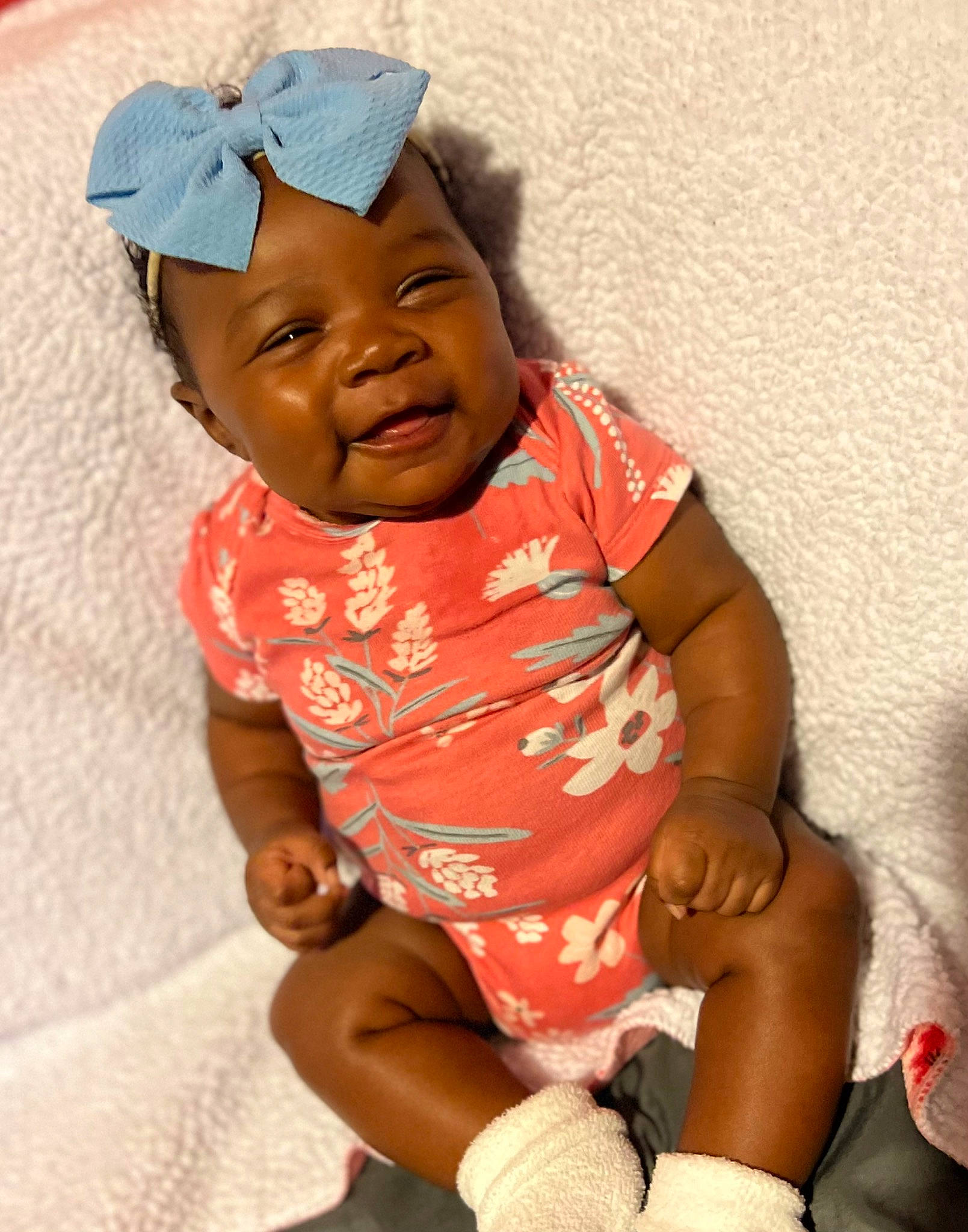 Khaylani joined the competition — help win amazing prizes! arm, baby, baby_toddler_clothing, cap, cheek, comfort, eye, facial_expression, finger, gesture, happy, headwear, mouth, person, pink, skin, sleeve, smile, t_shirt, thigh