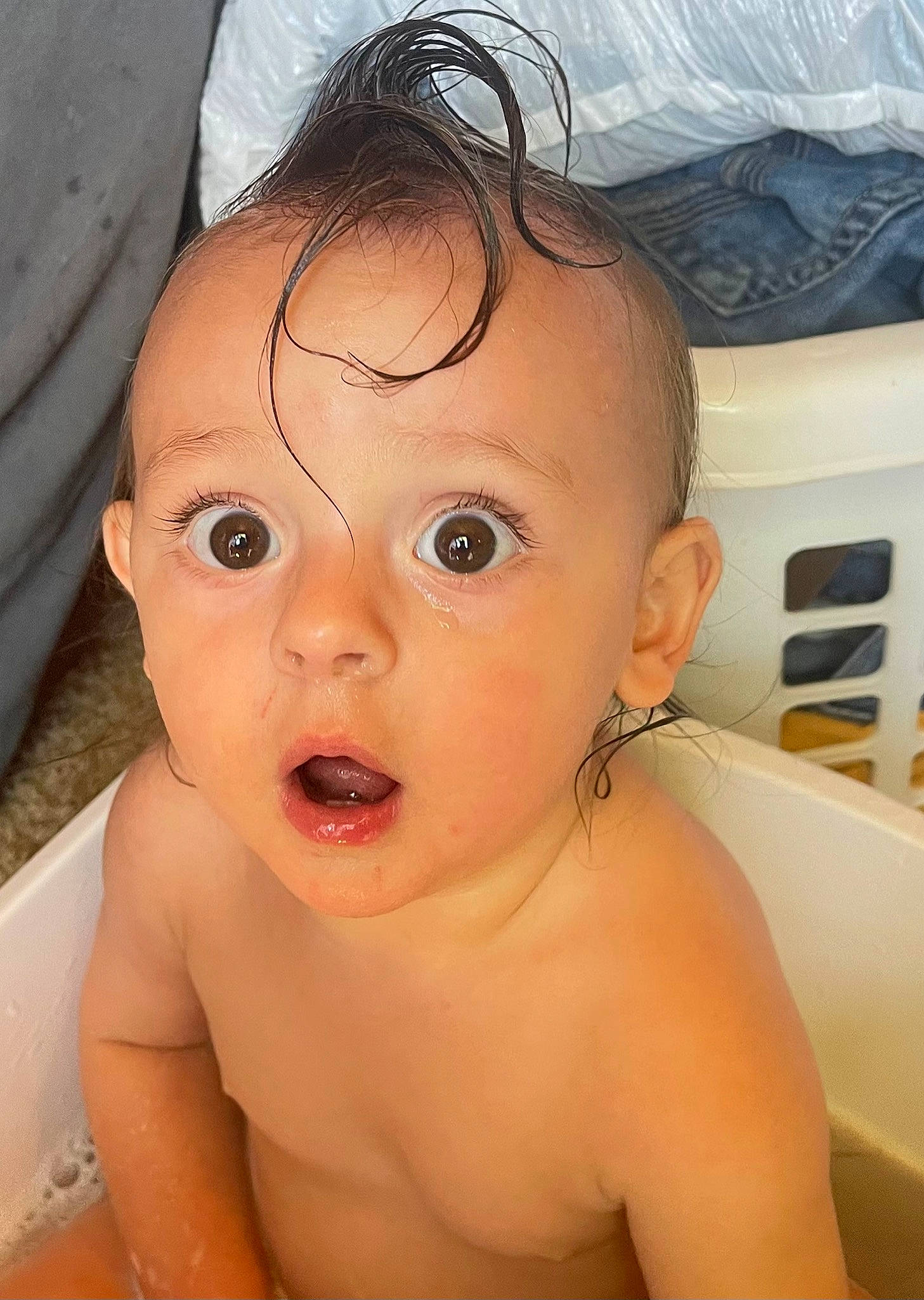 Callen is registered to the contest to win money with this photo: baby_bathing, bathing, black_hair, cheek, chest, ear, eye, eyebrow, eyelash, face, forehead, happy, iris, jaw, lip, mouth, nose, person, skin, surprise