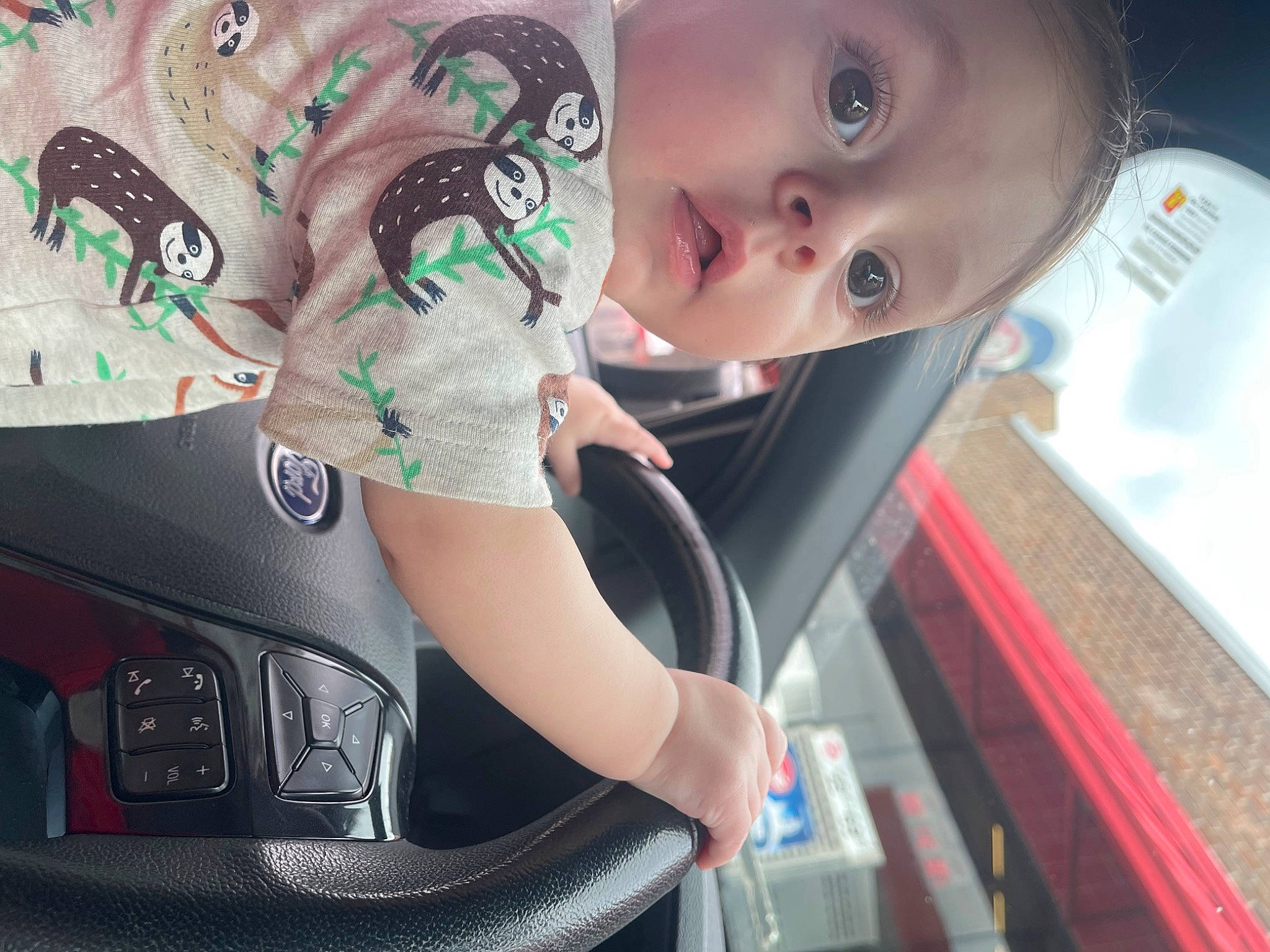 Callen is registered to the contest to win money with this photo: auto_part, automotive_design, automotive_exterior, automotive_lighting, automotive_tire, automotive_wheel_system, bumper, cool, eyewear, family_car, headlamp, hood, motor_vehicle, person, personal_luxury_car, rim, surprise, t_shirt, toddler, trunk