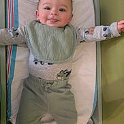 Dean joined the competition — help win amazing prizes! baby, infant, smiling, tongue_out, bib, onesie, pajamas, pants, crib, mattress, blanket, pillow, arms_outstretched, nursery, cheeky, cute, hair, face, skin, playful