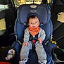 Dean joined the competition — help win amazing prizes! baby, child, car_seat, graco, smile, bib, sneakers, seatbelt, cupholder, vehicle_interior, window, sunlight, jumpsuit, hand, face, happy, backseat, fabric, toy, portrait