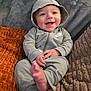 Dean joined the competition — help win amazing prizes! baby, infant, smiling, hoodie, nike, onesie, feet, hands, blanket, pillow, couch, cozy, portrait, indoor, cute, joyful, fabric_texture, relaxing, small_toes, zipper