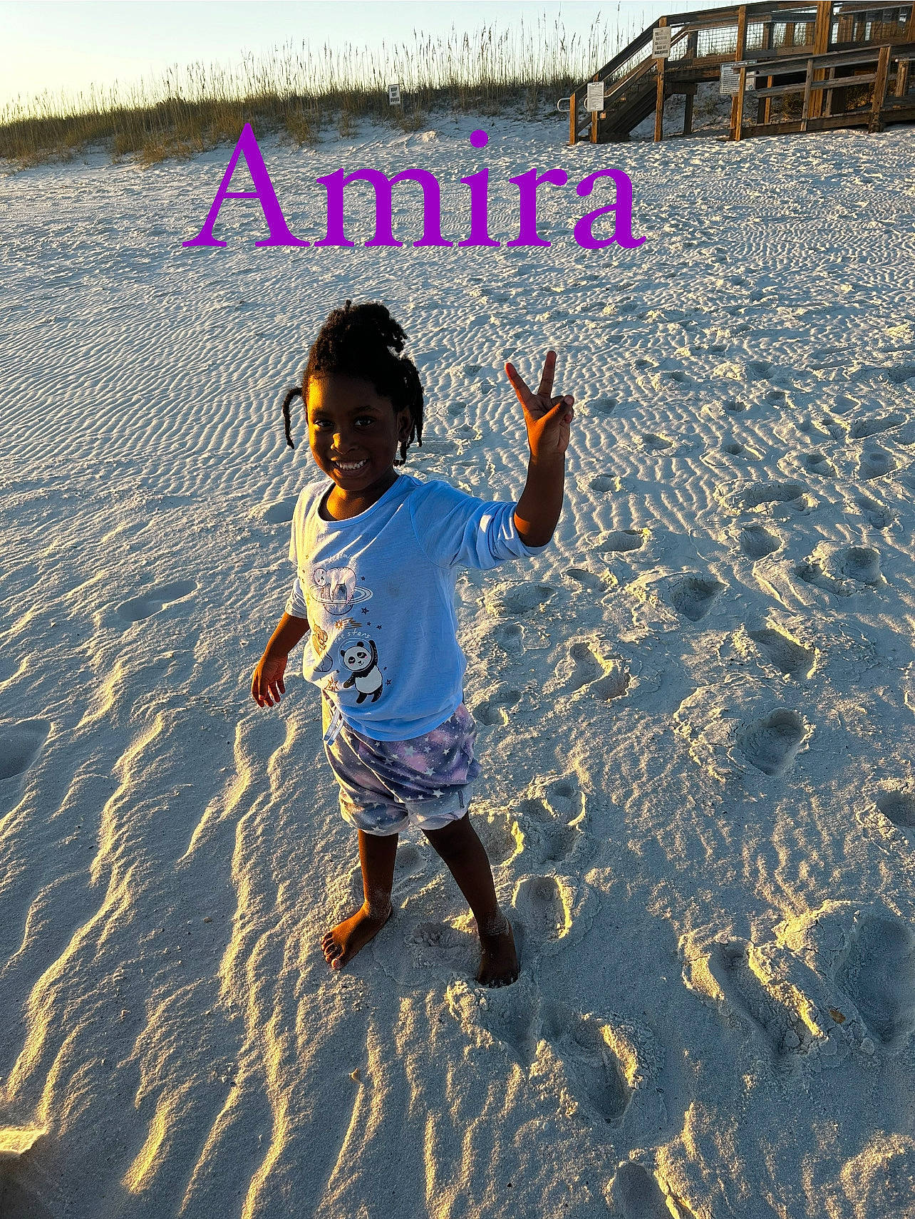 Amira is registered to the contest to win money with this photo: art, beach, cool, electric_blue, font, fun, happy, joy, landscape, leisure, pattern, people_in_nature, people_on_beach, person, play, sand, shadow, tints_and_shades, toddler, travel