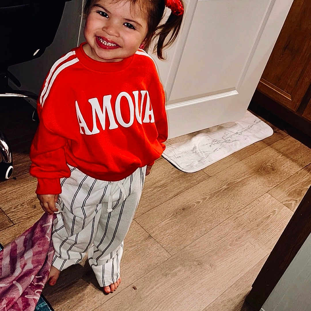 Kingsley joined the competition — help win amazing prizes! child, clothing, costume, door, dress, face, female, girl, happy, hardwood, head, indoors, mat, pants, person, photography, portrait, smile, t_shirt, wood